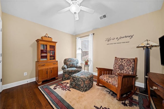 living area with hardwood / wood-style flooring, lofted ceiling, and ceiling fan