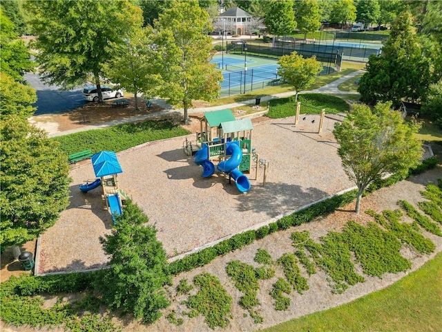 view of jungle gym with tennis court