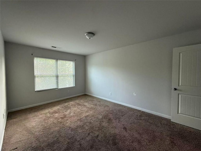 545 Tulip Ln, Mcdonough, GA 30252 - carpeted spare room featuring baseboards