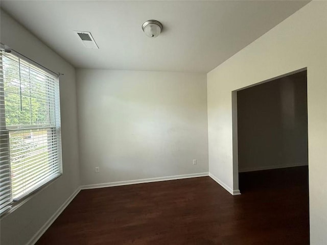 545 Tulip Ln, Mcdonough, GA 30252 - spare room featuring dark wood-type flooring and baseboards
