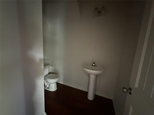 545 Tulip Ln, Mcdonough, GA 30252 - bathroom featuring toilet, a sink, and baseboards