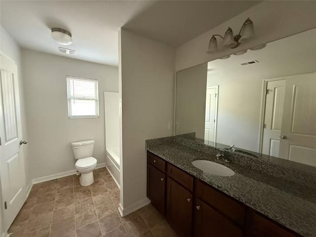 545 Tulip Ln, Mcdonough, GA 30252 - bathroom with toilet, vanity, and baseboards