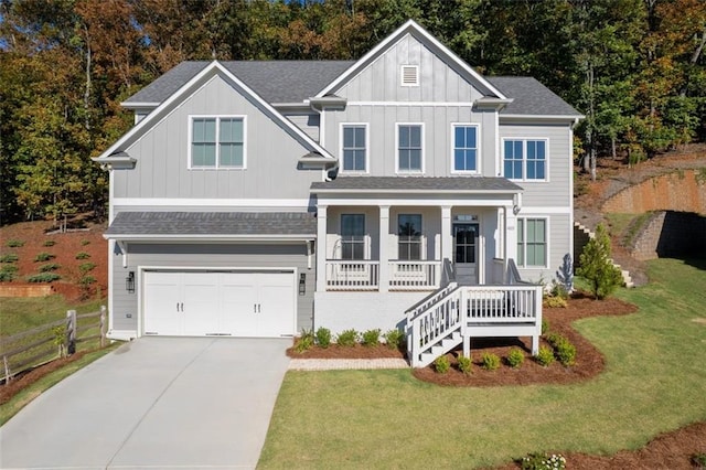 view of front facade featuring driveway, an attached garage, a porch, and roof with shingles