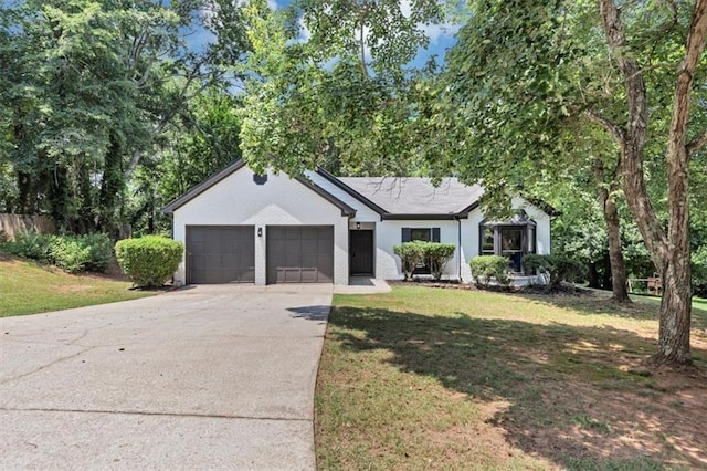 3021 Stone Bridge Trl SW, Conyers, GA 30094 - ranch-style house with a garage, concrete driveway, and a front lawn