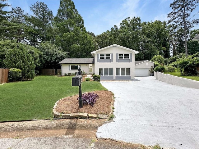 view of front facade featuring a garage and a front lawn