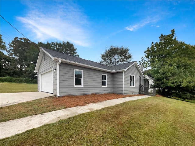 view of side of property with a yard