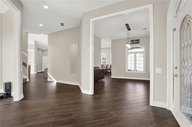 2150 Fincher Rd, Canton, GA 30114 - foyer entrance featuring dark wood-type flooring, baseboards, visible vents, and stairway