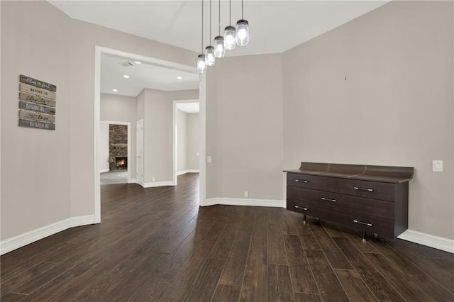 2150 Fincher Rd, Canton, GA 30114 - unfurnished dining area with dark wood-type flooring, baseboards, recessed lighting, and a fireplace