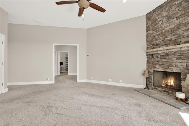 2150 Fincher Rd, Canton, GA 30114 - unfurnished living room featuring ceiling fan, baseboards, a stone fireplace, and carpet floors