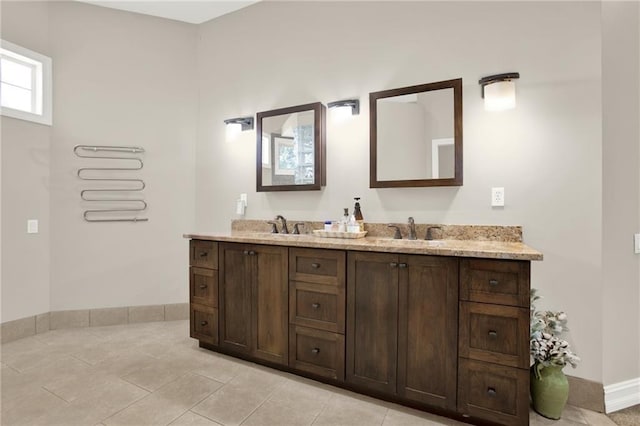 2150 Fincher Rd, Canton, GA 30114 - bathroom with a sink, baseboards, double vanity, and tile patterned flooring