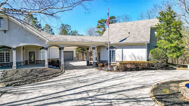 2150 Fincher Rd, Canton, GA 30114 - view of front of home with concrete driveway, stucco siding, stone siding, and a garage