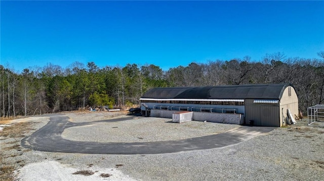 2150 Fincher Rd, Canton, GA 30114 - view of front of property featuring an outbuilding and a forest view