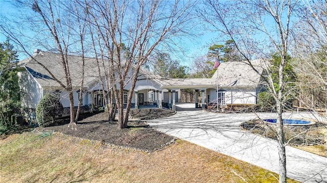 2150 Fincher Rd, Canton, GA 30114 - ranch-style home with a front yard, a carport, a porch, stucco siding, and driveway