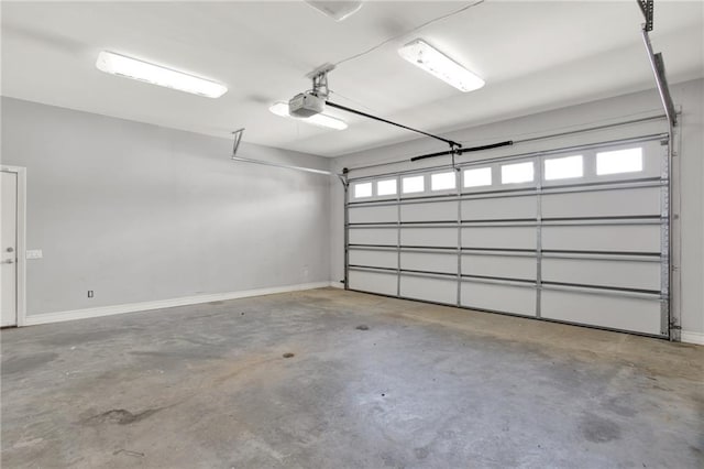 2150 Fincher Rd, Canton, GA 30114 - garage with a garage door opener and baseboards