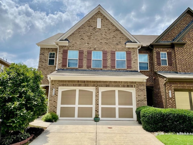 3534 Clancy Way, Smyrna, GA 30080 - view of property with concrete driveway, an attached garage, brick siding, and roof with shingles