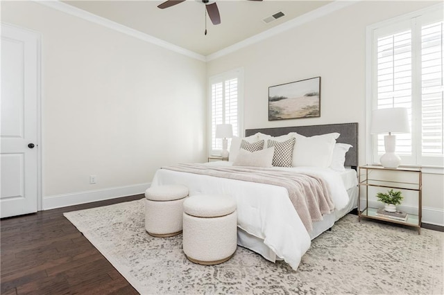 bedroom featuring multiple windows, ceiling fan, dark hardwood / wood-style flooring, and crown molding