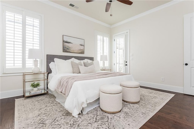 bedroom featuring ceiling fan, crown molding, and dark hardwood / wood-style floors