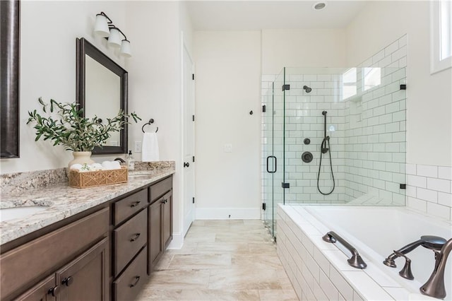 bathroom featuring plus walk in shower and vanity