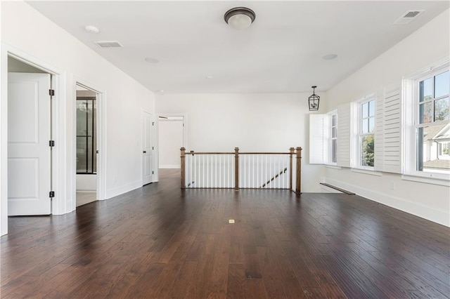 spare room featuring dark hardwood / wood-style floors