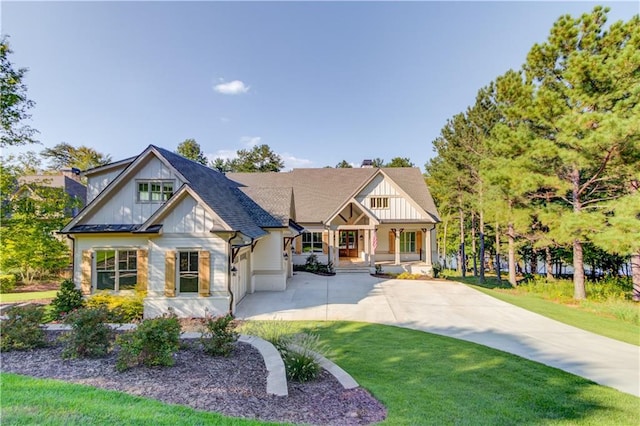 modern farmhouse with covered porch and a front lawn