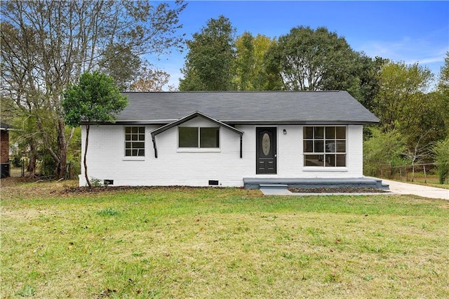 ranch-style home with a front lawn