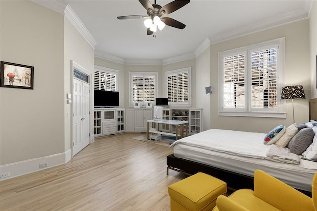 bedroom with light wood-style floors, crown molding, baseboards, and ceiling fan