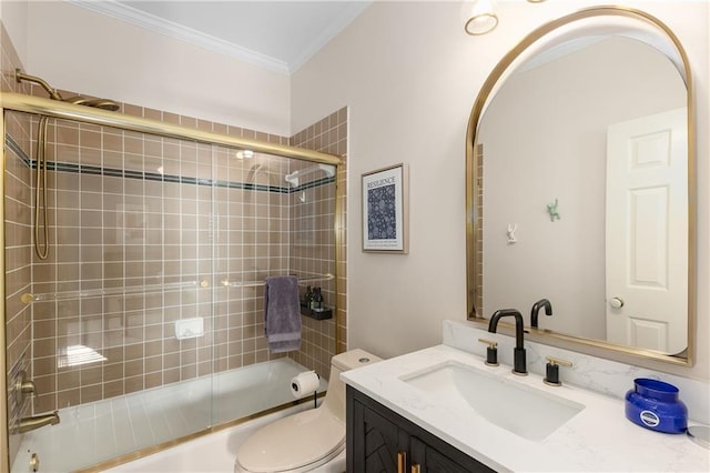 bathroom featuring shower / bath combination with glass door, vanity, toilet, and crown molding