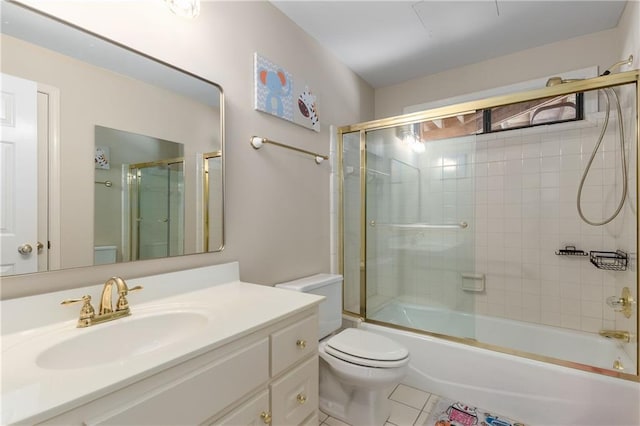 full bathroom featuring toilet, tile patterned flooring, bath / shower combo with glass door, and vanity