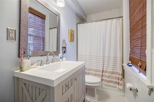 bathroom with toilet, shower / tub combo with curtain, and vanity