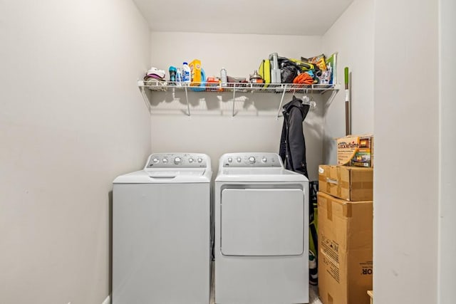 clothes washing area featuring washing machine and clothes dryer