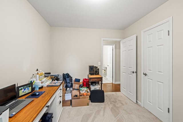 office area featuring light colored carpet