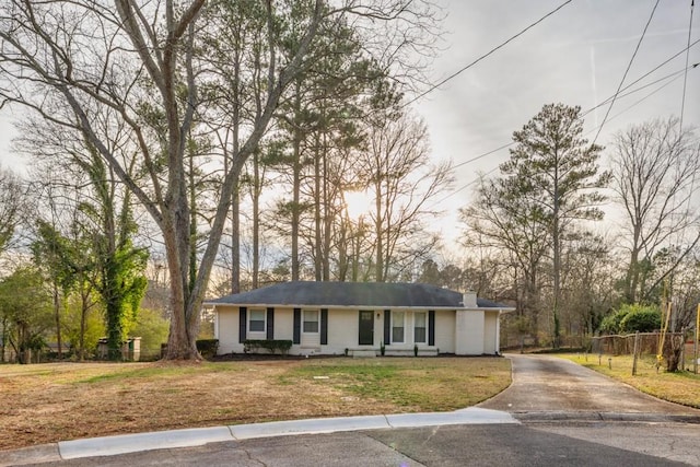 ranch-style home with a front yard