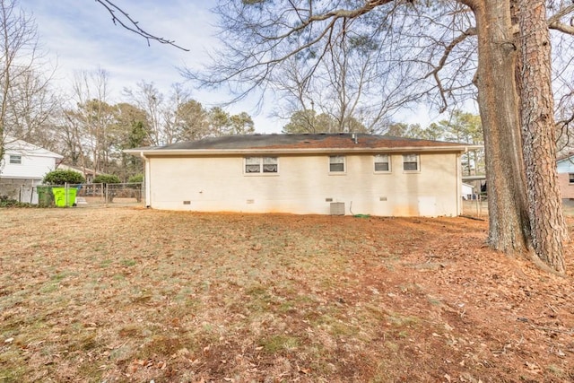 back of house featuring central AC unit