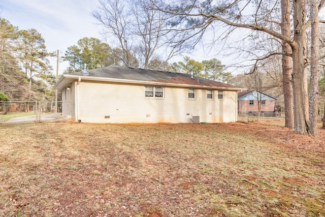 back of property featuring a yard and central air condition unit