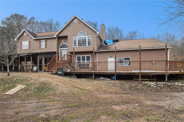 1275 Poole Bridge Rd, Hiram, GA 30141 - rear view of property featuring a chimney, a wooden deck, and a sunroom
