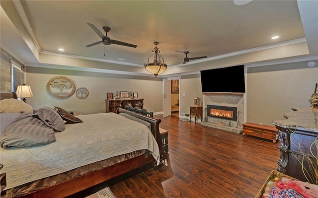 1330 Mccannon Morris Rd, Hull, GA 30646 - bedroom featuring a raised ceiling, crown molding, wood finished floors, and a glass covered fireplace
