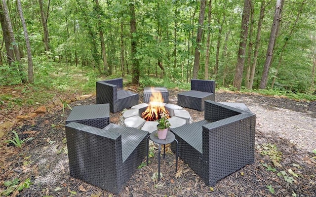1330 Mccannon Morris Rd, Hull, GA 30646 - view of patio / terrace with an outdoor fire pit and a wooded view
