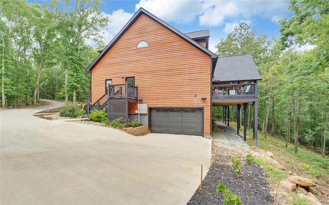 1330 Mccannon Morris Rd, Hull, GA 30646 - view of side of home featuring driveway, a garage, and a wooden deck