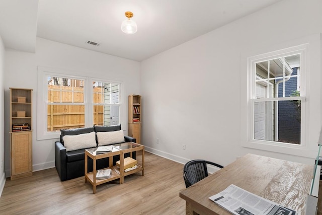 212 Haralson Ave NE, Atlanta, GA 30307 - home office with baseboards and light wood-style flooring