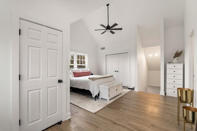 212 Haralson Ave NE, Atlanta, GA 30307 - bedroom with wood finished floors, high vaulted ceiling, a ceiling fan, and baseboards