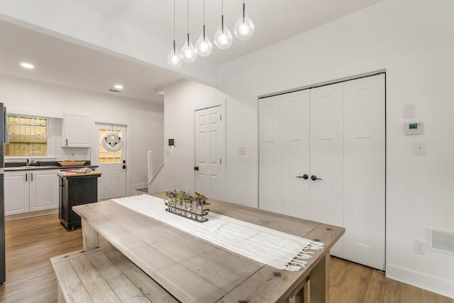 212 Haralson Ave NE, Atlanta, GA 30307 - dining room with light wood finished floors, recessed lighting, and baseboards