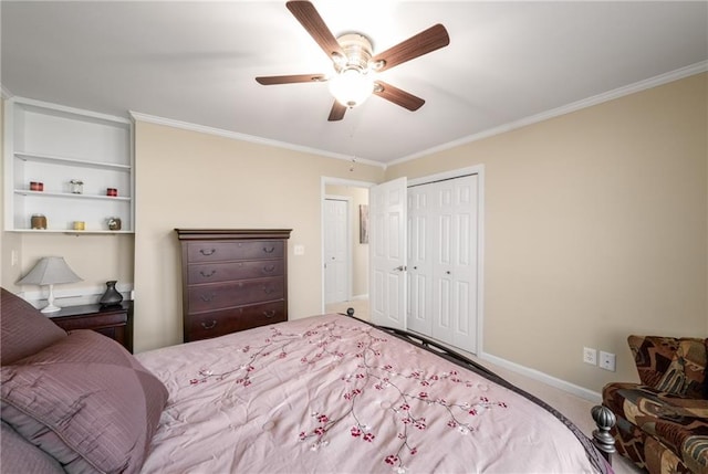 carpeted bedroom with a ceiling fan, baseboards, a closet, and ornamental molding