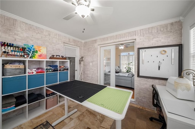 bedroom featuring ceiling fan, brick wall, and crown molding