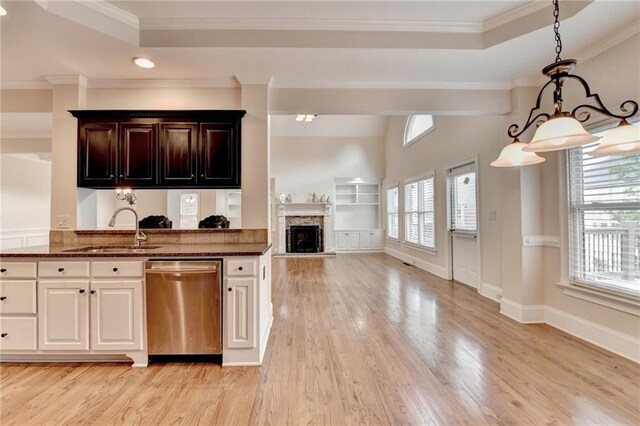 1054 Morgan Garner Dr SW, Lilburn, GA 30047 - kitchen with dishwasher, a sink, healthy amount of natural light, light wood-type flooring, and crown molding