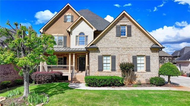 1054 Morgan Garner Dr SW, Lilburn, GA 30047 - craftsman-style house featuring brick siding, a porch, a front yard, and a standing seam roof