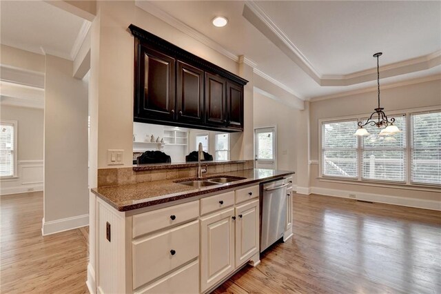 1054 Morgan Garner Dr SW, Lilburn, GA 30047 - kitchen featuring dishwasher, a sink, dark stone countertops, light wood-style floors, and crown molding
