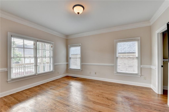 1054 Morgan Garner Dr SW, Lilburn, GA 30047 - unfurnished room with healthy amount of natural light, wood finished floors, ornamental molding, and baseboards