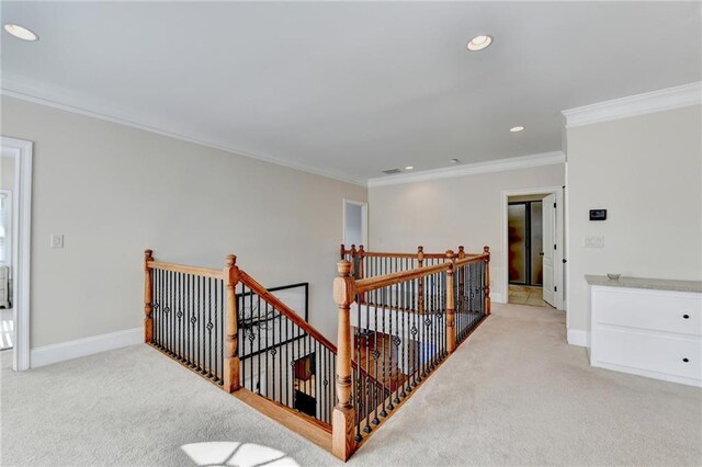 1054 Morgan Garner Dr SW, Lilburn, GA 30047 - hall with an upstairs landing, light carpet, crown molding, recessed lighting, and baseboards