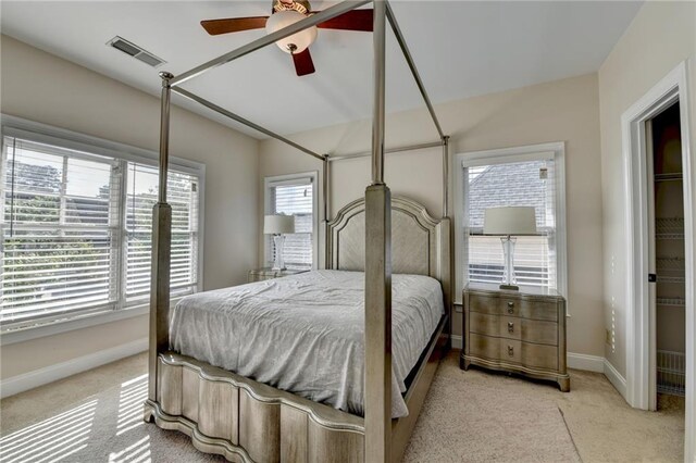 1054 Morgan Garner Dr SW, Lilburn, GA 30047 - bedroom with multiple windows, baseboards, carpet floors, and ceiling fan