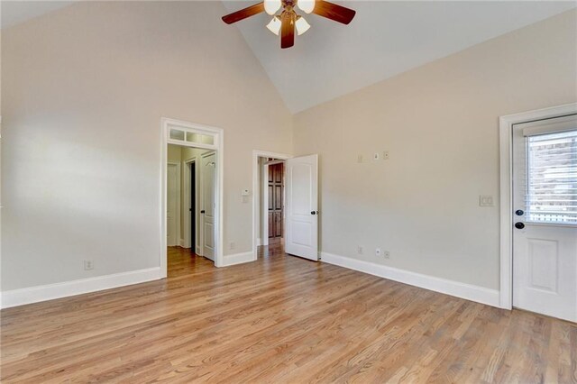 1054 Morgan Garner Dr SW, Lilburn, GA 30047 - empty room featuring ceiling fan, high vaulted ceiling, light wood-type flooring, and baseboards